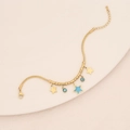 Detail of gold snake chain bracelet with star charms and blue beads on ceramic plate - Star & Blue Bead Snake Chain Bracelet (6#)
