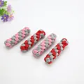 Set of four woven cotton rope dog chew toys in pink, red, and grey color schemes - Sausage