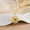 Macro shot of gold sun pendant necklace with center projection stone and micro zircons - Sunflower Projection Stone Gold (XL0302)