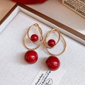 Macro detail of French vintage earrings with gold circles and red glossy beads - Silver Pin Red Bead Style / Gold-Red