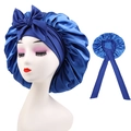 Detail of navy blue satin sleep bonnet with large bow and adjustable long ribbons - Cross-Royal Blue
