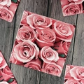 Floral paper napkins featuring blooming pink rose print on dark wood background - Pink Rose