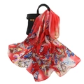 Elegant red chiffon scarf with vibrant butterfly print draped on a black leather bag - Large Butterfly Red