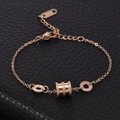 Set collana e bracciale in acciaio al titanio oro rosa con numeri romani su pelle nera - Bracciale
