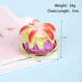 Realistic faux purple cream cake keychain with green glaze and floral resin details - D02 Apple