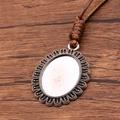 Antique silver oval pendant with hollow lace design on a brown braided PU cord - Hollow Carved Style(20)