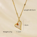 Detail of heart pendant necklace with gold finish, white shell inlay and red cubic zirconia - White Shell Heart