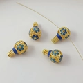 Macro detail of 18K gold-plated hot air balloon bead with blue enamel floral patterns - 30# Hollow Gourd 21X13mm / 1 Piece