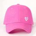 Detail shot of pink cotton baseball cap featuring a white heart print on a six-panel crown - One Size / Bright Pink