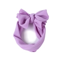 Fascia per neonati color lavanda con trama a nido d'ape e grande fiocco su sfondo bianco - Viola