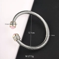 Detail showing cable twist bangle dimensions 5.7cm diameter and pink gemstone inlay - Pink Gemstone / Silver Cable