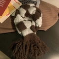 Brown and light grey checkered knit scarf with tassels on a stylish desk setting - Grey Brown