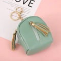 Mint green mini backpack coin purse with lychee grain texture and tassel keychain - Green