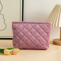 Close-up of pink corduroy quilted cosmetic bag with a tulip on a cozy bedside table - 27x6.5x17.5cm / Corduroy Purple