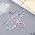 Pink and blue beaded phone charm with bow, heart and mushroom accents, 20cm length - K3562 Colored Rice Bead Bow Phone Chain
