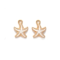 Detailed view of two gold starfish alloy pendants with white enamel for jewelry making - White