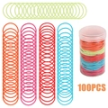 Dettaglio di 100 elastici per capelli colorati ad alta elasticità e barattolo incluso - 100 pezzi/barattolo / Multicolore