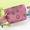 Pink corduroy makeup bag with black smiley face pattern and top zipper closure - Pink Smiley Face