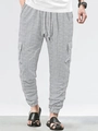 Detail of light grey cargo pants showing breathable knit texture and functional side pockets - Marl Grey