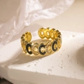 Detailed shot of bohemian gold ring with black enamel and zircons on marble base - Adjustable Open / Black