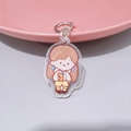 Cute acrylic keychain featuring a cartoon school girl in yellow uniform and silver hook - School Girl with Book (With Lobster Clasp)