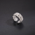Detail of silver lace cutout ring with white zircon stones on black background - Lace Hollow Zirconia Style (Style 7)