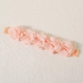 Pale pink baby headband with five layered tulle flowers on an elastic lace band - Pink Row Flowers