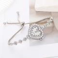 Montre cœur élégante pour femme avec lunette en strass et bracelet gourmette argenté - Argenté