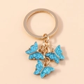 Sweet acrylic butterfly keychain with three blue glitter butterfly charms and gold ring - Blue Glitter (YZ172lanshan)