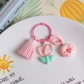 Pink tulip and donut resin keychain with leather tassel on a decorative white tray - Transparent Light Pink Tulip