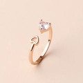 Detailed shot of rose gold open ring with heart-shaped zircon and hollow heart design - Adjustable Open / Rose Gold