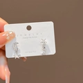 Minimalist silver celestial star and moon stud earrings on white jewelry card - E3596 Silver Star Moon Zircon