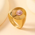 Macro shot of 18k gold vintage ring featuring an oval pink gemstone with radial textures - 6 / Oval Pink Gemstone / Gold