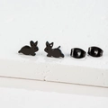 Detailed macro view of black rabbit stud earrings on a textured stone surface - Rabbit Shape(163) / Black
