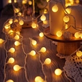 Frosted ball LED string lights in warm yellow for Christmas and cozy home decor - 1.5m 10LED Battery / Small Round Ball