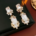 Macro detail of vintage gold square earrings with sparkling clear crystal stones - Silver Needle-Transparent