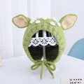 Green knit baby hat with white pompom and ear flaps for warmth and comfort - Light Green Giraffe - Lined