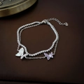 Detail of double-layer butterfly bracelet with purple zircon and shell charm on leather - Silver