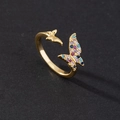 Macro detail of open butterfly ring featuring multi-color cubic zirconia and golden finish - Style K-Gold Colored Full Zircon Butterfly