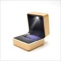 Champagne gold LED ring box with velvet interior and focused spotlight illumination - Rounded Corner Gold-rimmed Light Box - Gold (clearance); Ring Box (can Hold Earrings)