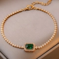 Bracelet tennis doré avec zircons blancs et pierre centrale verte à la coupe émeraude - Alliage Éco Émeraude Zirconium Baguette (5355283371547)
