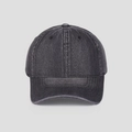 Detailed texture of washed charcoal grey denim fabric on a minimalist baseball cap - Gray