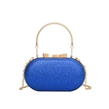 Blue textured oval evening bag with gold chain strap and bow clasp on white background - Blue
