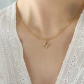 Elegant gold necklace featuring a zircon-encrusted letter H pendant on titanium steel - Letter H / Gold