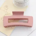 Pink matte rectangular claw clip for thick hair with hollow geometric design - Pink