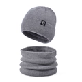 Winter set in medium grey featuring a fleece-lined knitted beanie and matching neck warmer - Two-Piece Set / Gray