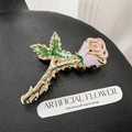 Metallic rose hair claw clip in pink enamel and gold finish on black leather surface - Rose 11cm