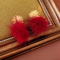 Detailed close-up of zircon fireworks earrings with luxury dark red fluffy pom-poms - Red (Silver Earring Post)