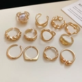 Detailed flat lay of eleven assorted gold starfish and geometric adjustable rings - 12pcs Set / Gold