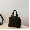 Minimalist black insulated canvas lunch bag for kids featuring a sturdy top handle and zipper - Black